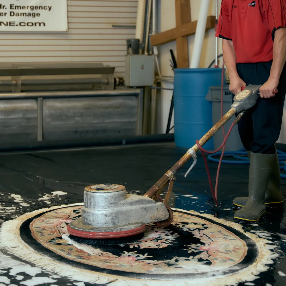 Cleaning a carpet at a rug shop
